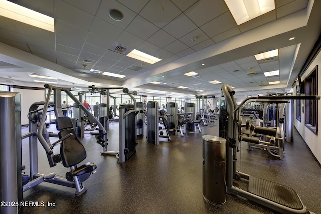 exercise room featuring a paneled ceiling