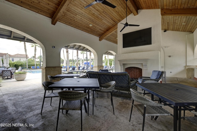 carpeted dining room with beam ceiling, high vaulted ceiling, ceiling fan, and wooden ceiling