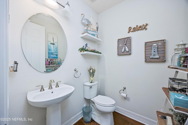 bathroom with sink and toilet