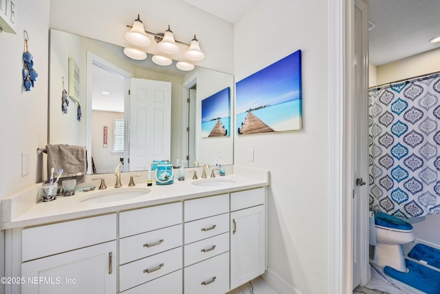 bathroom with a shower with shower curtain, a textured ceiling, vanity, and toilet