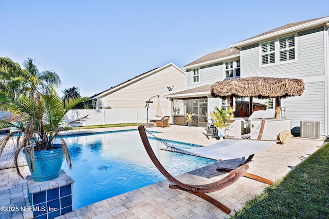 view of swimming pool featuring a patio, area for grilling, and cooling unit