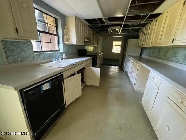 kitchen featuring sink and black appliances