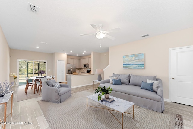 living room with ceiling fan