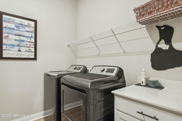 laundry room with washing machine and clothes dryer