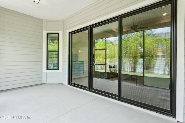 exterior space with a patio area and ceiling fan