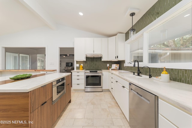 kitchen with backsplash, stainless steel appliances, sink, lofted ceiling with beams, and white cabinetry