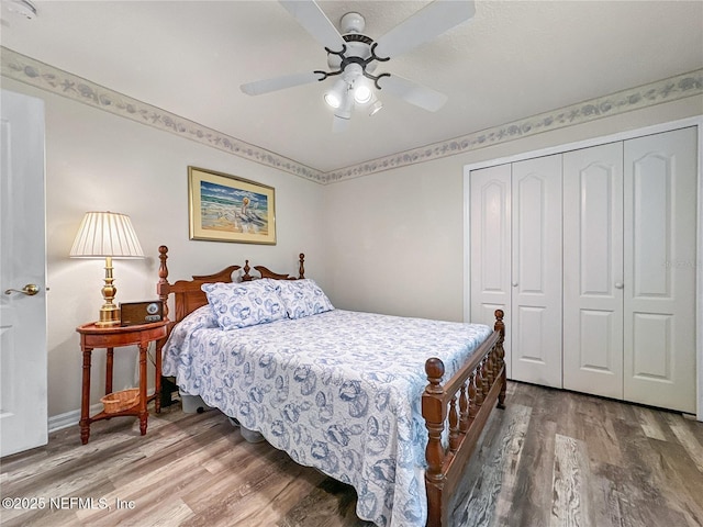 bedroom featuring ceiling fan, a closet, and hardwood / wood-style flooring