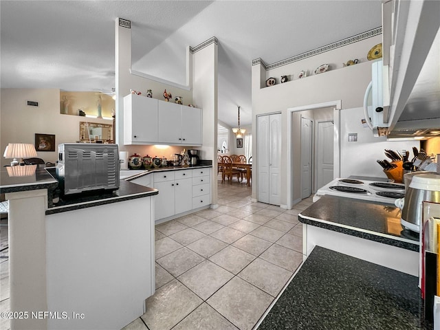 kitchen featuring kitchen peninsula, electric range oven, light tile patterned floors, high vaulted ceiling, and white cabinets