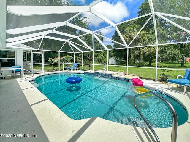 view of pool with pool water feature, glass enclosure, a yard, and a patio