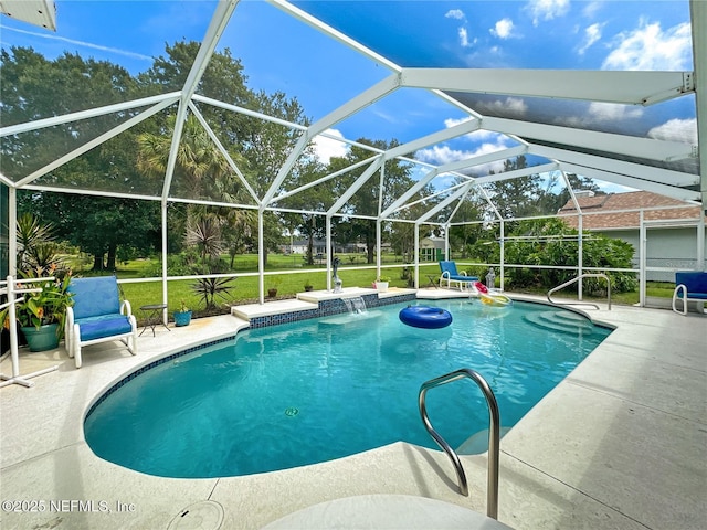 view of swimming pool with a lanai, pool water feature, a lawn, and a patio