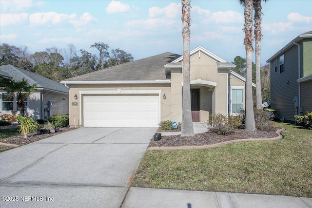 view of front of home with a garage and a front lawn