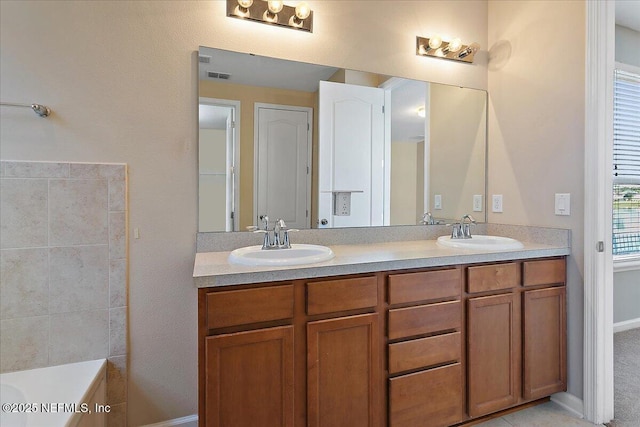 bathroom with vanity and a bathing tub