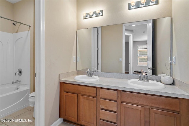 full bathroom with tile patterned flooring, vanity, toilet, and washtub / shower combination