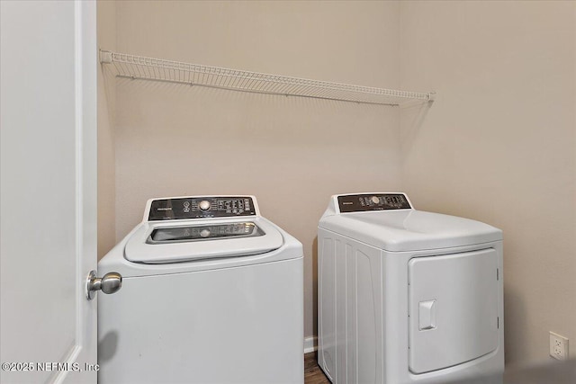 clothes washing area featuring washing machine and clothes dryer