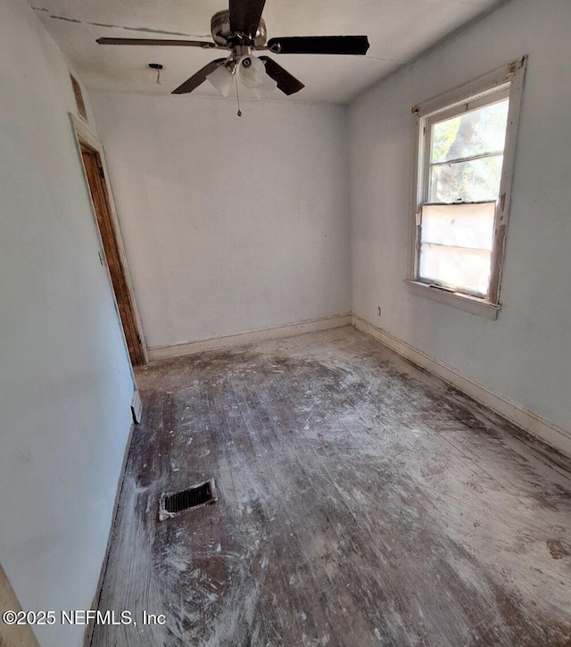 empty room featuring wood-type flooring