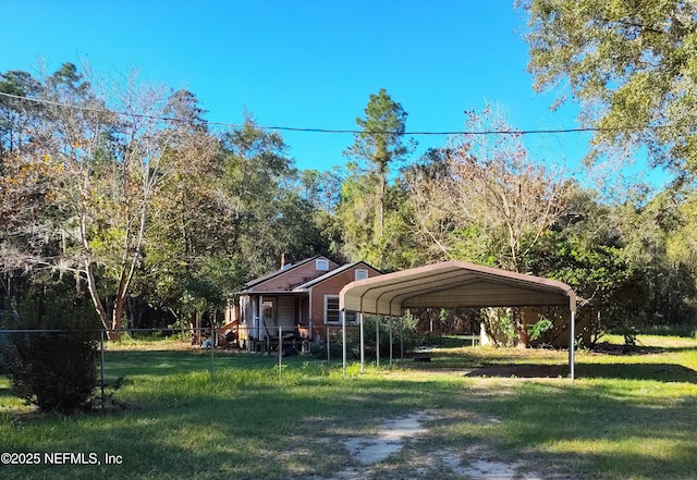 exterior space featuring a carport and a front lawn