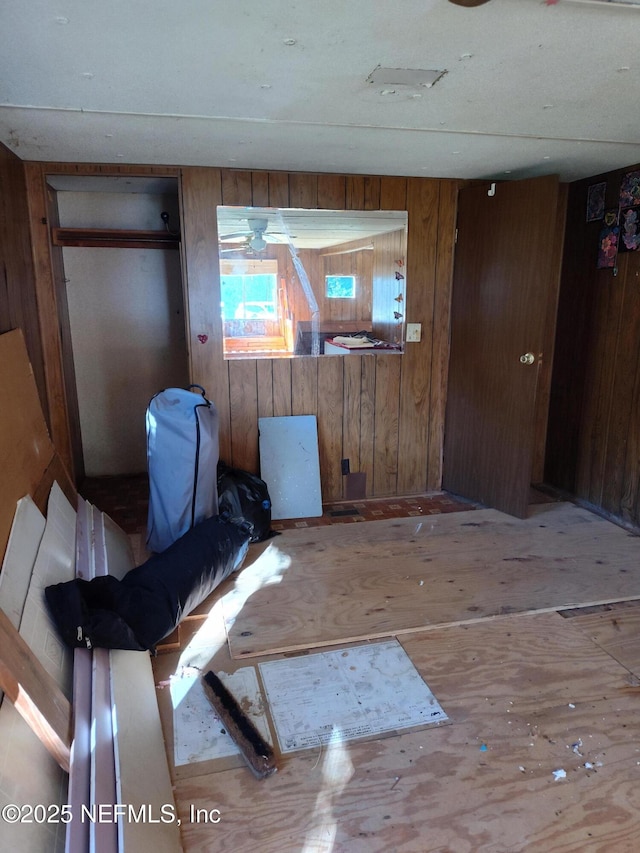 interior space featuring wooden walls and light hardwood / wood-style flooring