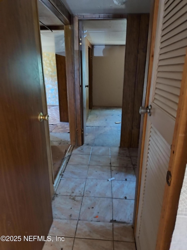 hallway featuring light tile patterned floors