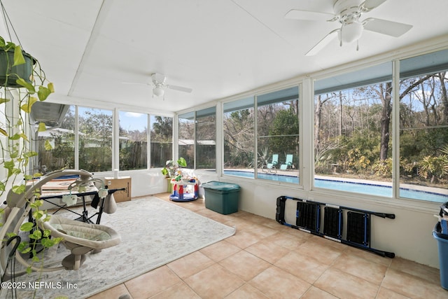 sunroom / solarium with ceiling fan