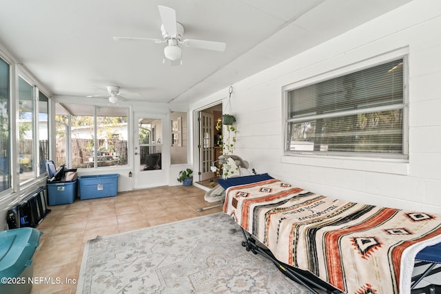 bedroom with ceiling fan and light tile patterned flooring