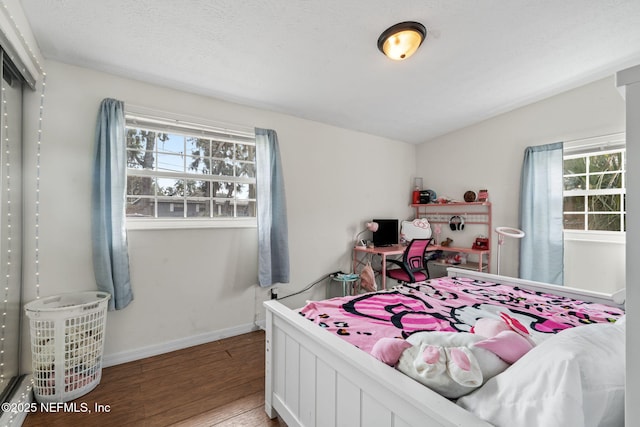 bedroom featuring hardwood / wood-style floors