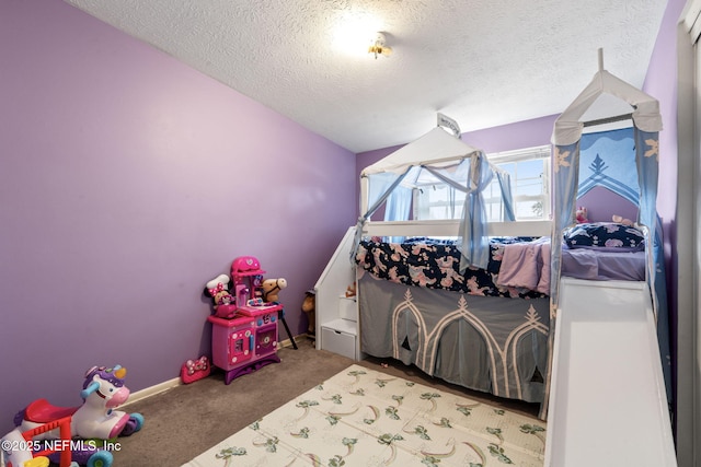 bedroom featuring lofted ceiling, carpet, and a textured ceiling