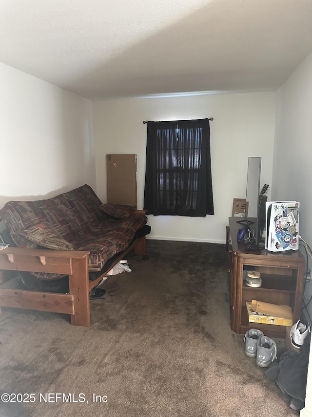 bedroom featuring dark carpet