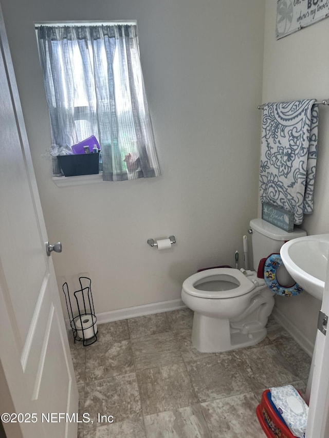 bathroom with sink and toilet