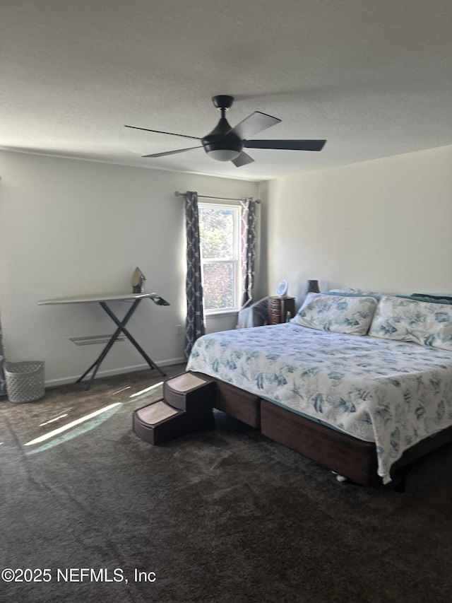 carpeted bedroom with ceiling fan