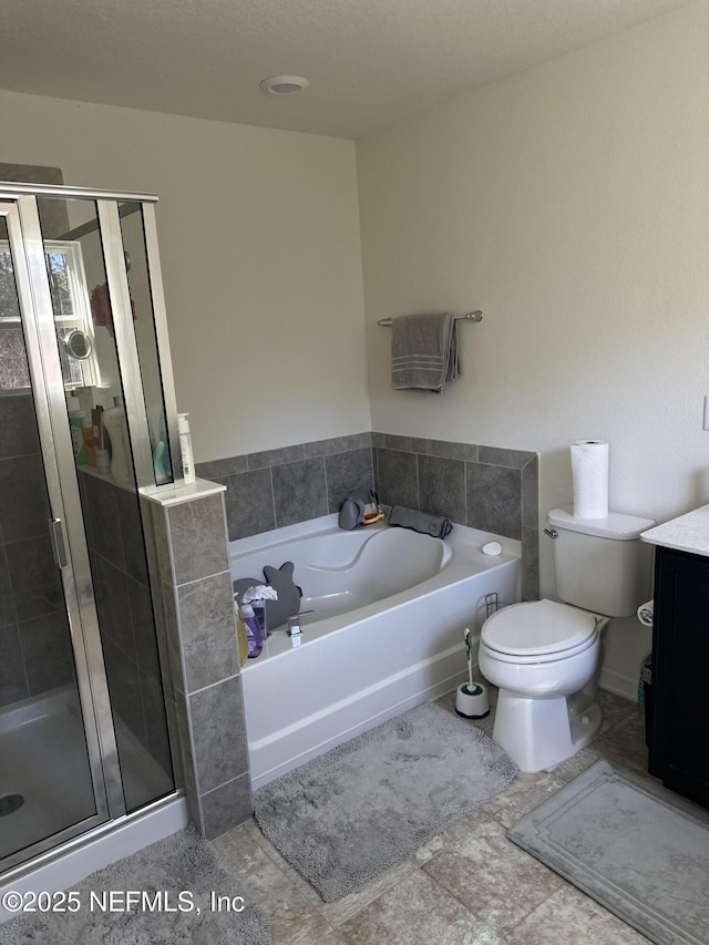 full bathroom featuring vanity, independent shower and bath, and toilet