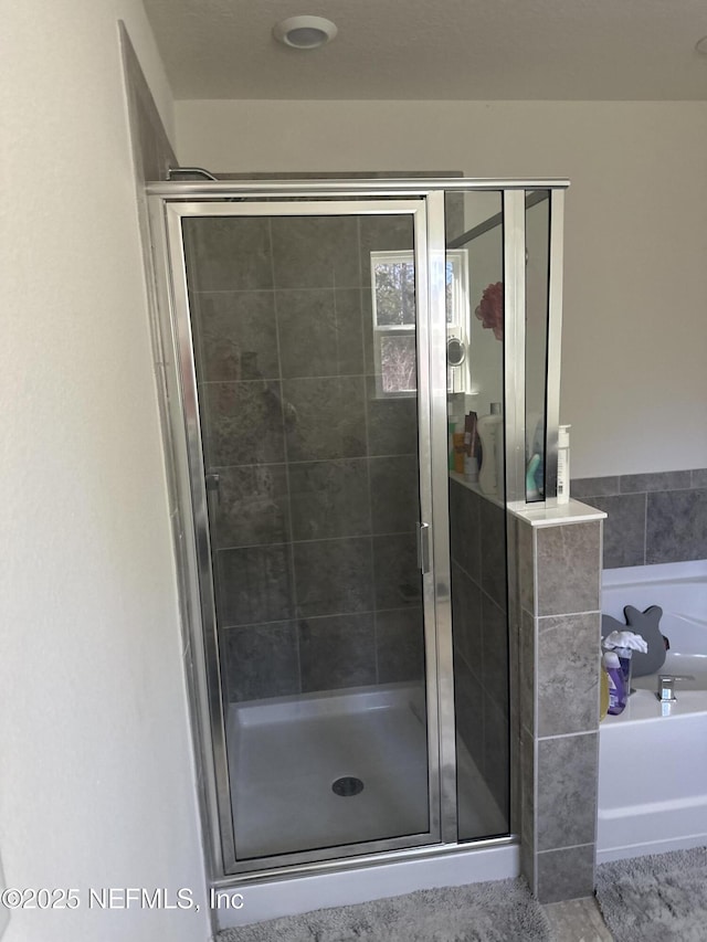 bathroom with independent shower and bath