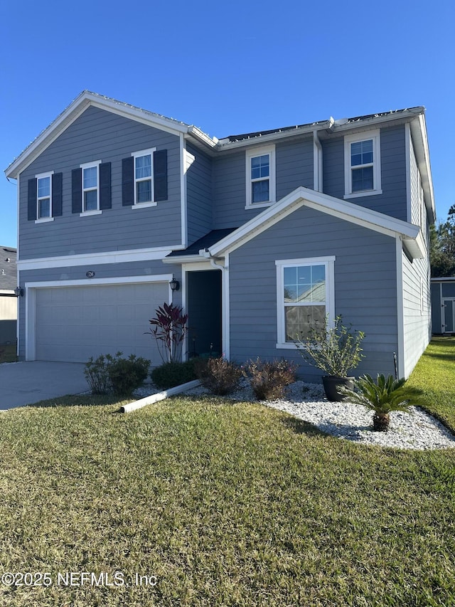 front facade featuring a garage and a front lawn