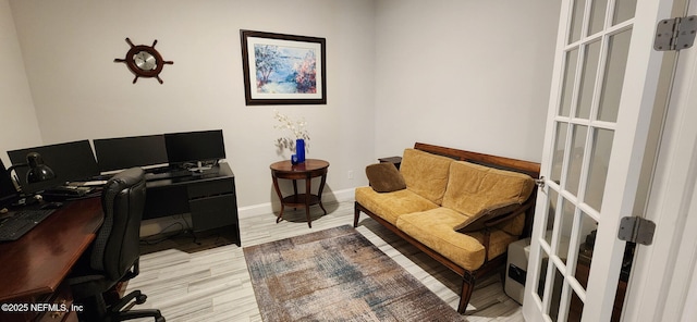 office area featuring french doors and light wood-type flooring