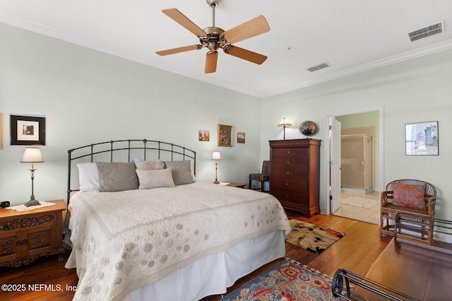 bedroom with wood-type flooring, ornamental molding, and ceiling fan