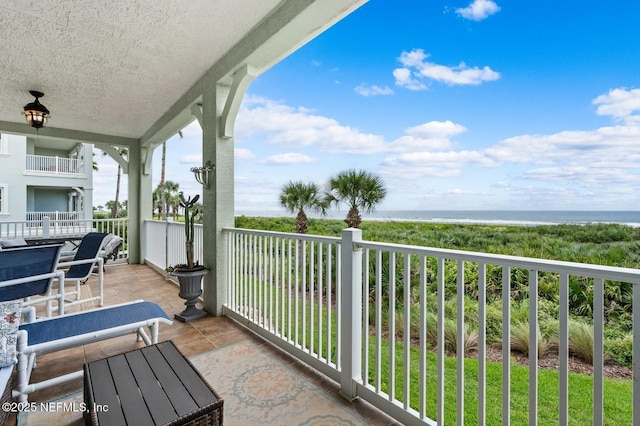 balcony featuring a water view