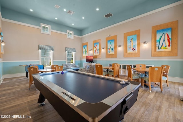 recreation room featuring light wood-type flooring