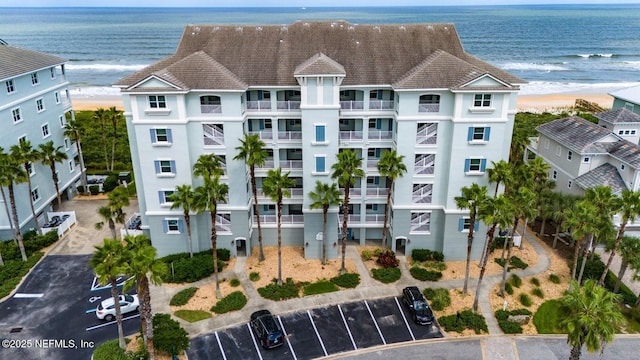 bird's eye view featuring a water view and a view of the beach