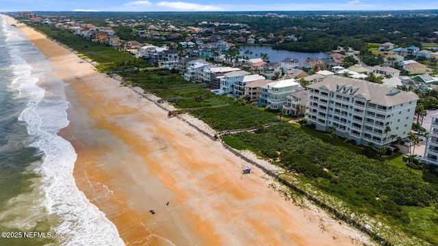 bird's eye view with a view of the beach and a water view