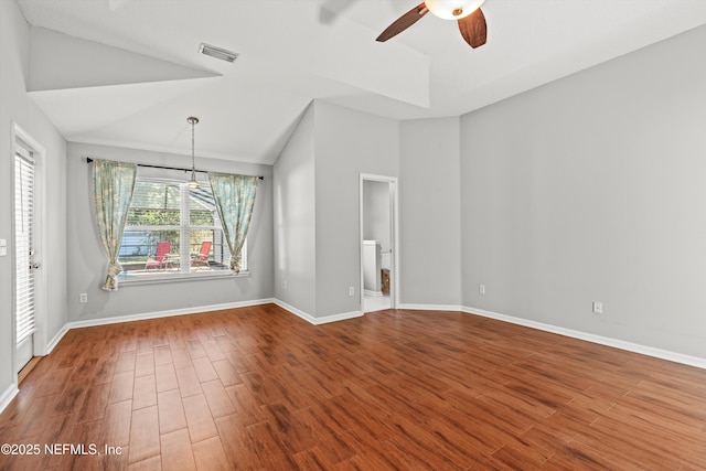 unfurnished room featuring hardwood / wood-style floors, ceiling fan, and vaulted ceiling