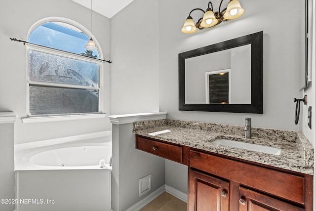 bathroom with vanity, a tub to relax in, and tile patterned floors