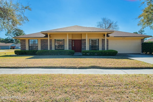 view of front of home with a garage and a front yard