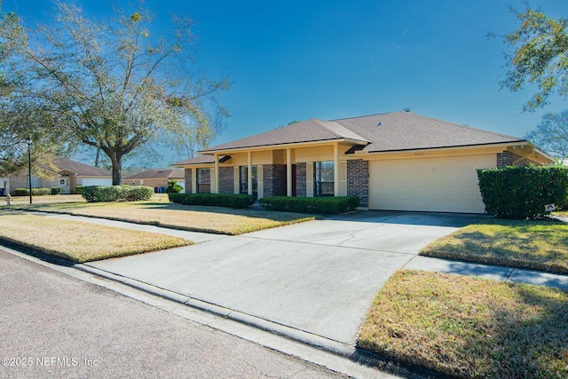 ranch-style home with a front yard and a garage