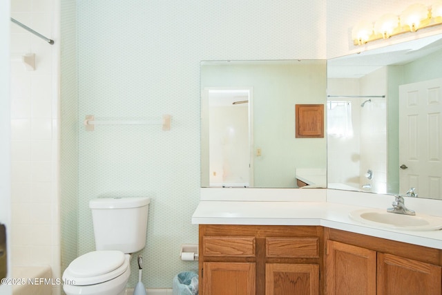 bathroom featuring toilet and vanity