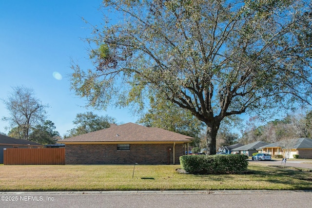 view of property exterior with a lawn