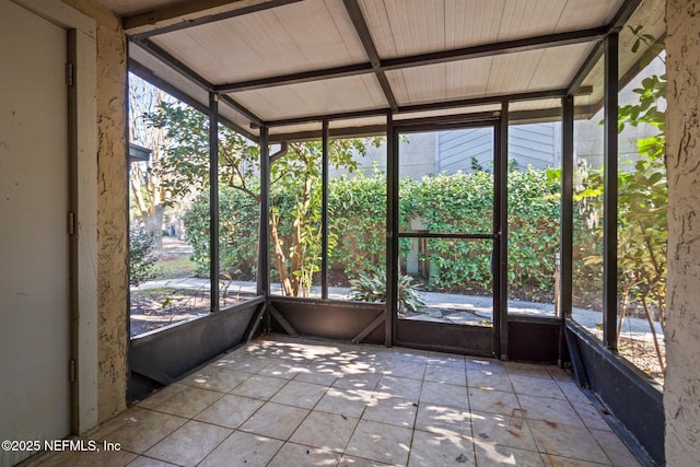 unfurnished sunroom with a wealth of natural light