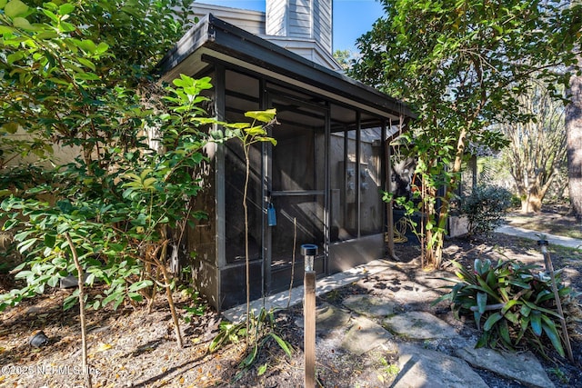 view of home's exterior featuring a sunroom