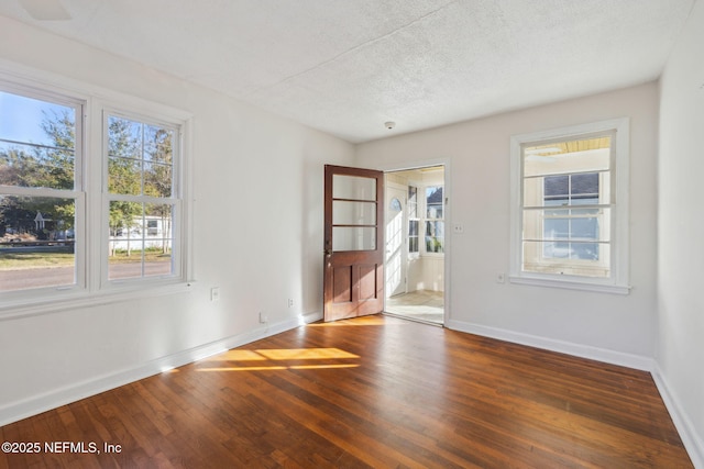 spare room featuring dark hardwood / wood-style floors