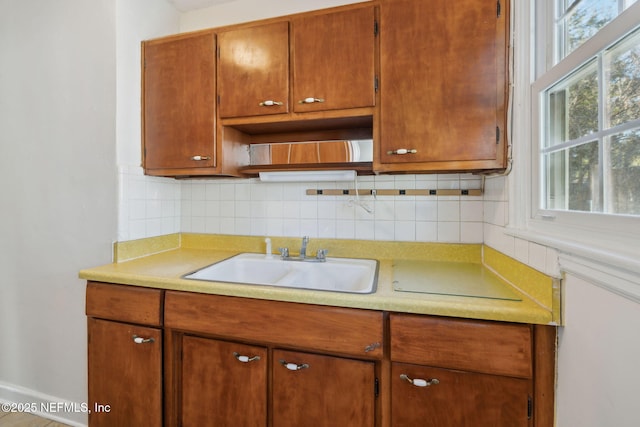 kitchen featuring sink and decorative backsplash