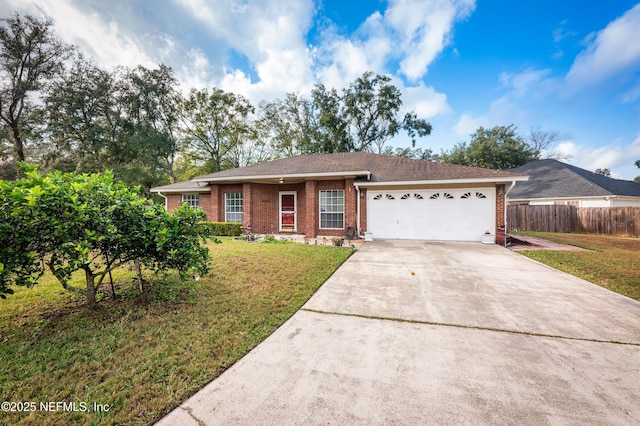 ranch-style home featuring a garage and a front lawn