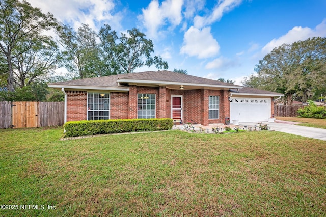 ranch-style house featuring a garage and a front yard